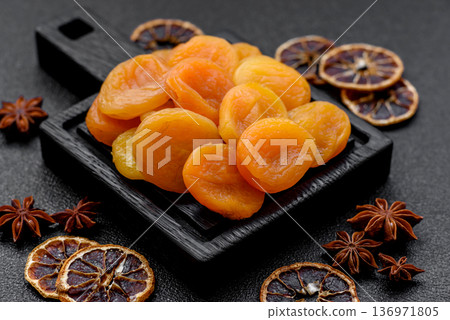 Dried apricots are a sweet, healthy fruit for vegans and vegetarians. Dried apricot Dried apricots are a sweet, healthy fruit for vegans and vegetarians. Dried apricot 136971805