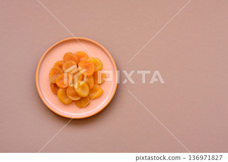 Dried apricots are a sweet, healthy fruit for vegans and vegetarians. Dried apricot Dried apricots are a sweet, healthy fruit for vegans and vegetarians. Dried apricot 136971827