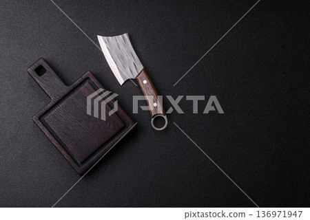 Empty wooden cutting board with a knife for food preparation. An empty wooden cutting board Empty wooden cutting board with a knife for food preparation. An empty wooden cutting board 136971947