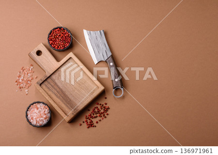 Empty wooden cutting board with a knife for food preparation. An empty wooden cutting board Empty wooden cutting board with a knife for food preparation. An empty wooden cutting board 136971961