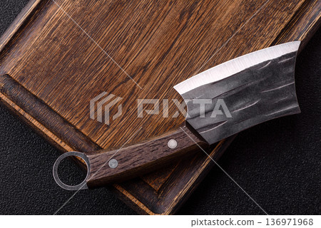 Empty wooden cutting board with a knife for food preparation. An empty wooden cutting board Empty wooden cutting board with a knife for food preparation. An empty wooden cutting board 136971968