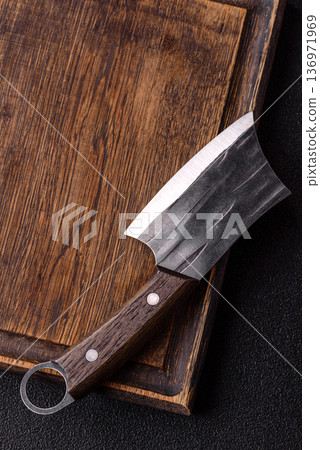 Empty wooden cutting board with a knife for food preparation. An empty wooden cutting board Empty wooden cutting board with a knife for food preparation. An empty wooden cutting board 136971969