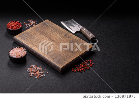 Empty wooden cutting board with a knife for food preparation. An empty wooden cutting board Empty wooden cutting board with a knife for food preparation. An empty wooden cutting board 136971973