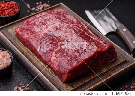 A piece of raw beef, a tenderloin for grilling or barbecue. Raw beef 136971985