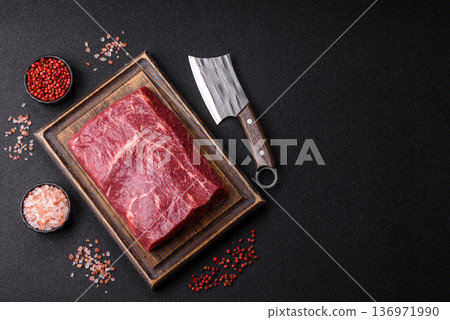 A piece of raw beef, a tenderloin for grilling or barbecue. Raw beef 136971990