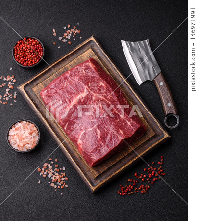 A piece of raw beef, a tenderloin for grilling or barbecue. Raw beef 136971991