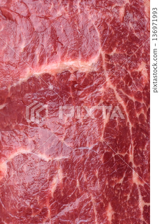 A piece of raw beef, a tenderloin for grilling or barbecue. Raw beef 136971993