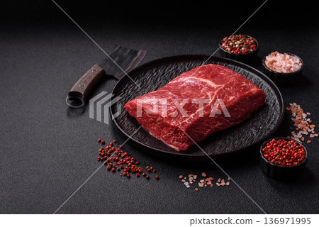 A piece of raw beef, a tenderloin for grilling or barbecue. Raw beef 136971995