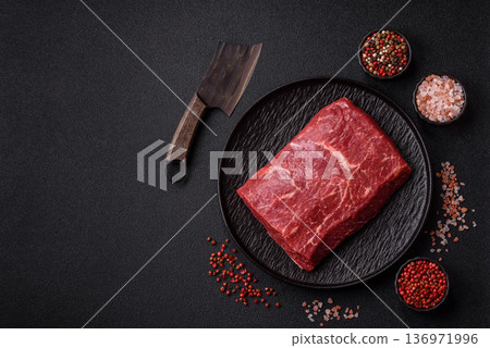 A piece of raw beef, a tenderloin for grilling or barbecue. Raw beef 136971996