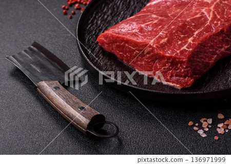 A piece of raw beef, a tenderloin for grilling or barbecue. Raw beef 136971999