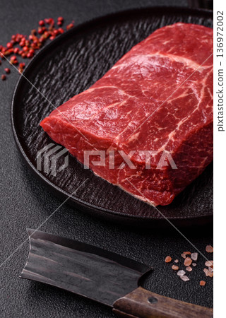 A piece of raw beef, a tenderloin for grilling or barbecue. Raw beef 136972002
