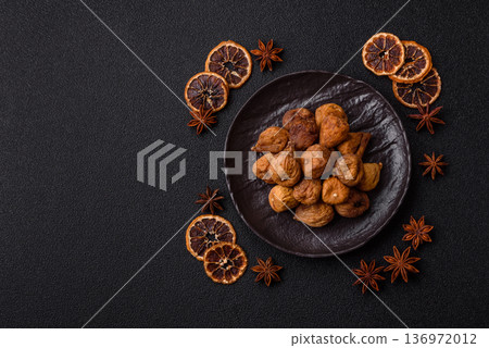 Dried fig are a sweet, healthy fruit for vegans and vegetarians. Dried fig as a food background Dried fig are a sweet, healthy fruit for vegans and vegetarians. Dried fig as a food background 136972012
