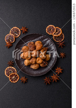 Dried fig are a sweet, healthy fruit for vegans and vegetarians. Dried fig as a food background Dried fig are a sweet, healthy fruit for vegans and vegetarians. Dried fig as a food background 136972013