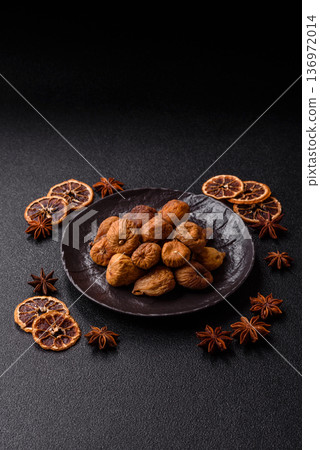 Dried fig are a sweet, healthy fruit for vegans and vegetarians. Dried fig as a food background 136972014