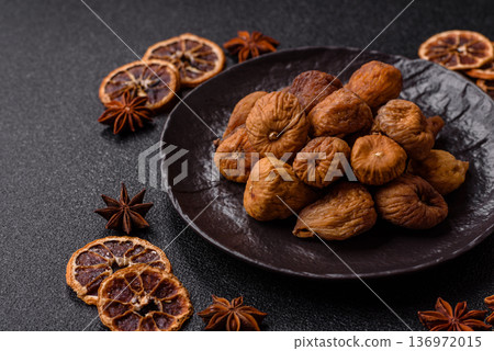 Dried fig are a sweet, healthy fruit for vegans and vegetarians. Dried fig as a food background Dried fig are a sweet, healthy fruit for vegans and vegetarians. Dried fig as a food background 136972015