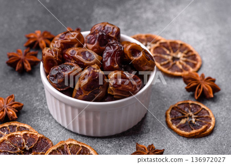 Dried sweet dates, natural tropical fruits for a healthy diet. Dried dates Dried sweet dates, natural tropical fruits for a healthy diet. Dried dates 136972027