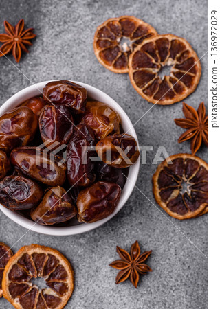 Dried sweet dates, natural tropical fruits for a healthy diet. Dried dates Dried sweet dates, natural tropical fruits for a healthy diet. Dried dates 136972029