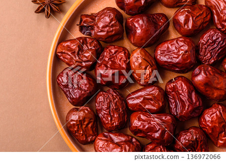 Red dried dates, the Chinese sweet fruit jujube, as a healthy food. Red dates, jujube Red dried dates, the Chinese sweet fruit jujube, as a healthy food. Red dates, jujube 136972066