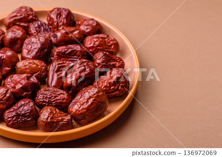 Red dried dates, the Chinese sweet fruit jujube, as a healthy food. Red dates, jujube Red dried dates, the Chinese sweet fruit jujube, as a healthy food. Red dates, jujube 136972069