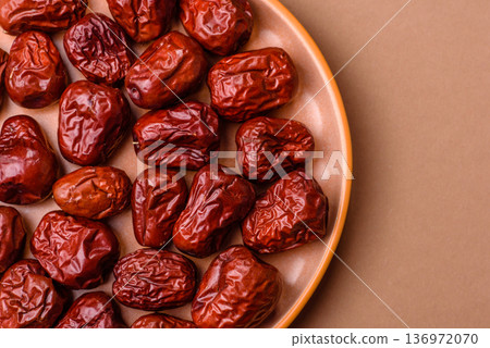 Red dried dates, the Chinese sweet fruit jujube, as a healthy food. Red dates, jujube Red dried dates, the Chinese sweet fruit jujube, as a healthy food. Red dates, jujube 136972070