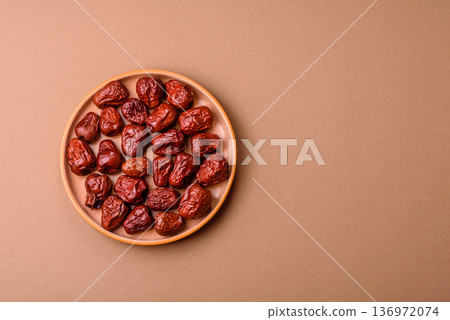 Red dried dates, the Chinese sweet fruit jujube, as a healthy food. Red dates, jujube Red dried dates, the Chinese sweet fruit jujube, as a healthy food. Red dates, jujube 136972074