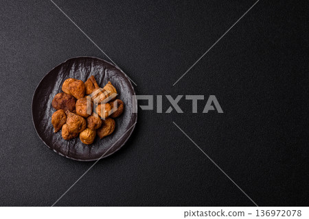 Dried fig are a sweet, healthy fruit for vegans and vegetarians. Dried fig as a food background Dried fig are a sweet, healthy fruit for vegans and vegetarians. Dried fig as a food background 136972078