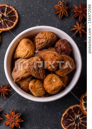 Dried fig are a sweet, healthy fruit for vegans and vegetarians. Dried fig as a food background Dried fig are a sweet, healthy fruit for vegans and vegetarians. Dried fig as a food background 136972086