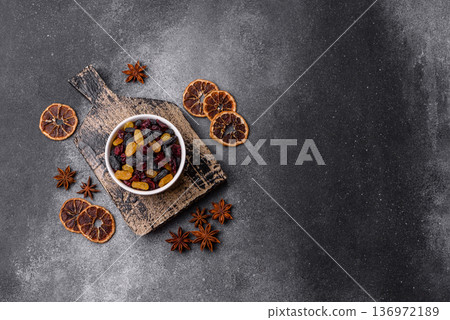 Dried cranberries, yellow and black sweet raisins as ingredients for a breakfast. Raisins and cranberries Dried cranberries, yellow and black sweet raisins as ingredients for a breakfast. Raisins and cranberries 136972189