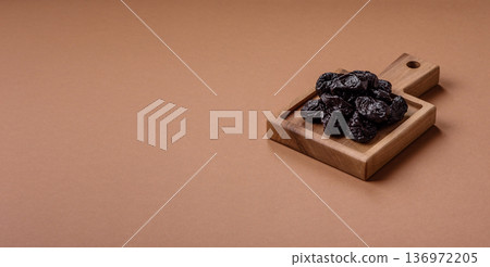 Sweet dried plums or prunes, organic dehydrated fruit for dietary nutrition. Prunes or dried plums Sweet dried plums or prunes, organic dehydrated fruit for dietary nutrition. Prunes or dried plums 136972205