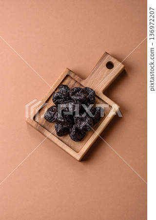 Sweet dried plums or prunes, organic dehydrated fruit for dietary nutrition. Prunes or dried plums Sweet dried plums or prunes, organic dehydrated fruit for dietary nutrition. Prunes or dried plums 136972207