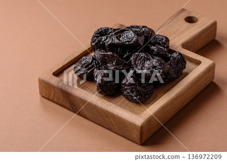 Sweet dried plums or prunes, organic dehydrated fruit for dietary nutrition. Prunes or dried plums Sweet dried plums or prunes, organic dehydrated fruit for dietary nutrition. Prunes or dried plums 136972209