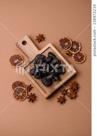 Sweet dried plums or prunes, organic dehydrated fruit for dietary nutrition. Prunes or dried plums Sweet dried plums or prunes, organic dehydrated fruit for dietary nutrition. Prunes or dried plums 136972219