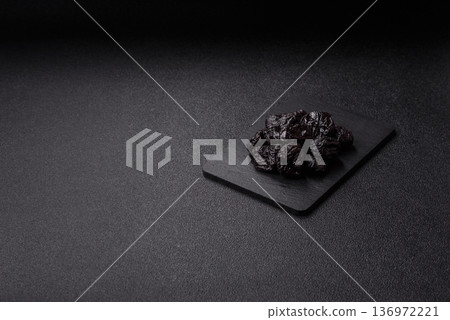 Sweet dried plums or prunes, organic dehydrated fruit for dietary nutrition. Prunes or dried plums Sweet dried plums or prunes, organic dehydrated fruit for dietary nutrition. Prunes or dried plums 136972221