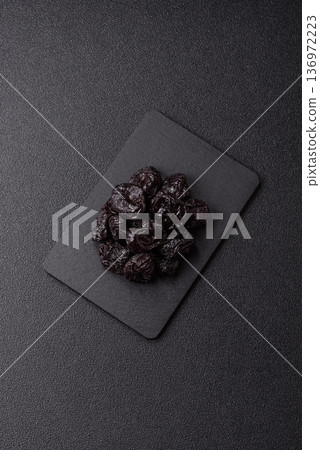 Sweet dried plums or prunes, organic dehydrated fruit for dietary nutrition. Prunes or dried plums Sweet dried plums or prunes, organic dehydrated fruit for dietary nutrition. Prunes or dried plums 136972223