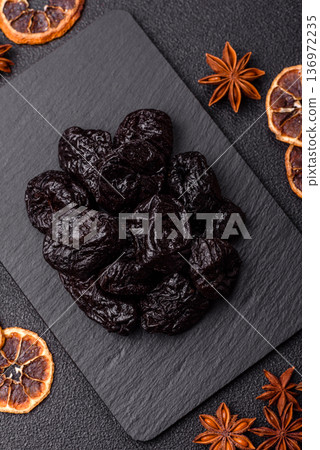 Sweet dried plums or prunes, organic dehydrated fruit for dietary nutrition. Prunes or dried plums Sweet dried plums or prunes, organic dehydrated fruit for dietary nutrition. Prunes or dried plums 136972235
