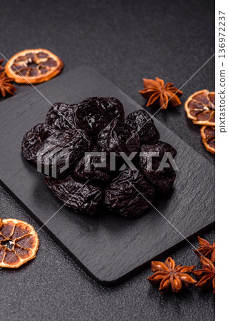 Sweet dried plums or prunes, organic dehydrated fruit for dietary nutrition. Prunes or dried plums Sweet dried plums or prunes, organic dehydrated fruit for dietary nutrition. Prunes or dried plums 136972237