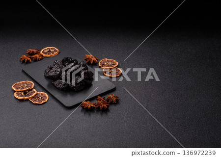 Sweet dried plums or prunes, organic dehydrated fruit for dietary nutrition. Prunes or dried plums 136972239
