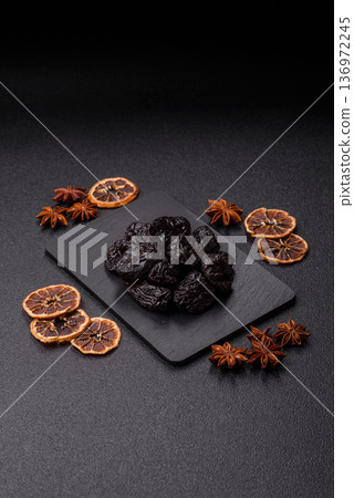 Sweet dried plums or prunes, organic dehydrated fruit for dietary nutrition. Prunes or dried plums Sweet dried plums or prunes, organic dehydrated fruit for dietary nutrition. Prunes or dried plums 136972245
