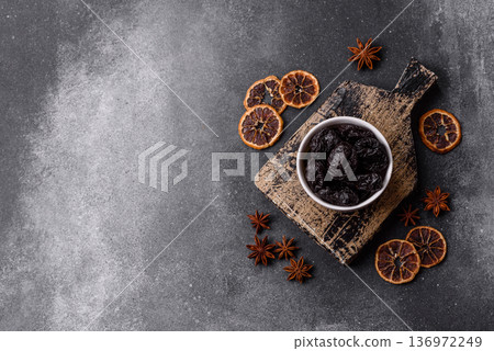 Sweet dried plums or prunes, organic dehydrated fruit for dietary nutrition. Prunes or dried plums Sweet dried plums or prunes, organic dehydrated fruit for dietary nutrition. Prunes or dried plums 136972249