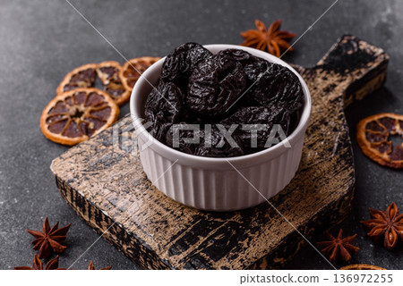 Sweet dried plums or prunes, organic dehydrated fruit for dietary nutrition. Prunes or dried plums Sweet dried plums or prunes, organic dehydrated fruit for dietary nutrition. Prunes or dried plums 136972255