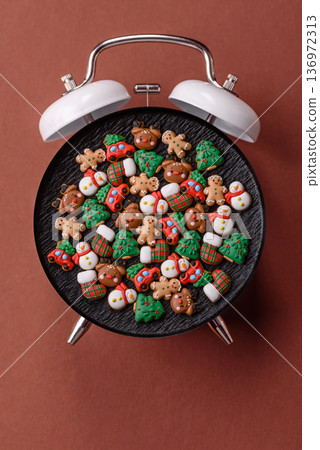 Vintage alarm clock on brown surface as a conceptual background for deadlines for tasks 136972313