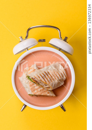 Shawarma with chicken or beef, tortilla roll, and vegetables. Shawarma with meat 136972334