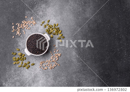 Black sesame seeds in a bowl, an ingredient for oil and healthy eating. Black sesame 136972802