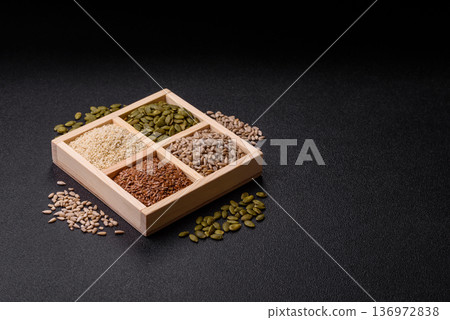 Flax, pumpkin, sunflower, and sesame seeds, ingredients for healthy eating 136972838