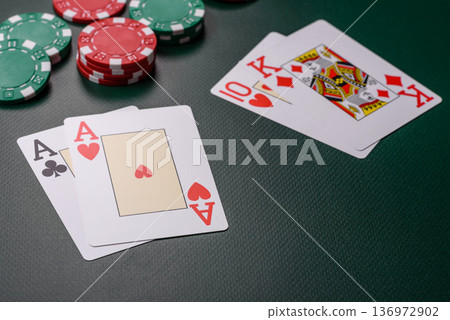 Casino, cards and chips on a colored background, poker and blackjack, gambling. Cards and chips Casino, cards and chips on a colored background, poker and blackjack, gambling. Cards and chips 136972902