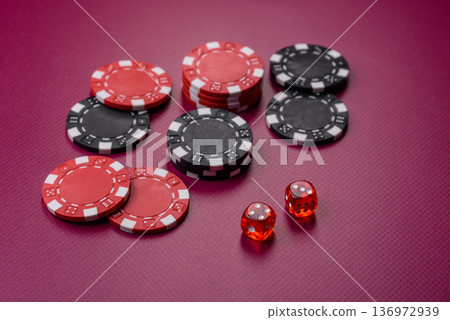 Casino dice and chips on a colored background, poker, gambling with bets. Dice and chips Casino dice and chips on a colored background, poker, gambling with bets. Dice and chips 136972939