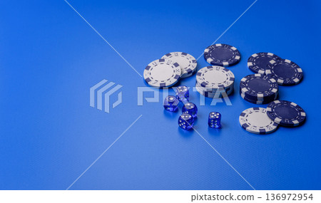 Casino dice and chips on a colored background, poker, gambling with bets. Dice and chips Casino dice and chips on a colored background, poker, gambling with bets. Dice and chips 136972954