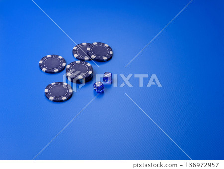 Casino dice and chips on a colored background, poker, gambling with bets. Dice and chips Casino dice and chips on a colored background, poker, gambling with bets. Dice and chips 136972957