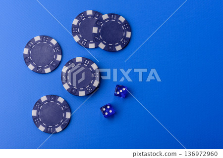 Casino dice and chips on a colored background, poker, gambling with bets. Dice and chips Casino dice and chips on a colored background, poker, gambling with bets. Dice and chips 136972960