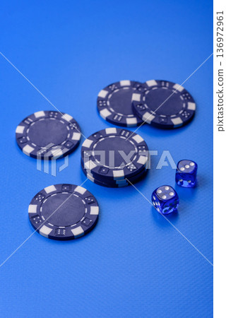 Casino dice and chips on a colored background, poker, gambling with bets. Dice and chips Casino dice and chips on a colored background, poker, gambling with bets. Dice and chips 136972961